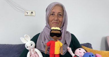 Neslihan Demir poses with the handmade &quot;Osimhen doll&quot; in the Yeşilhisar district, Kayseri, Türkiye, May 11, 2025. (AA Photo)