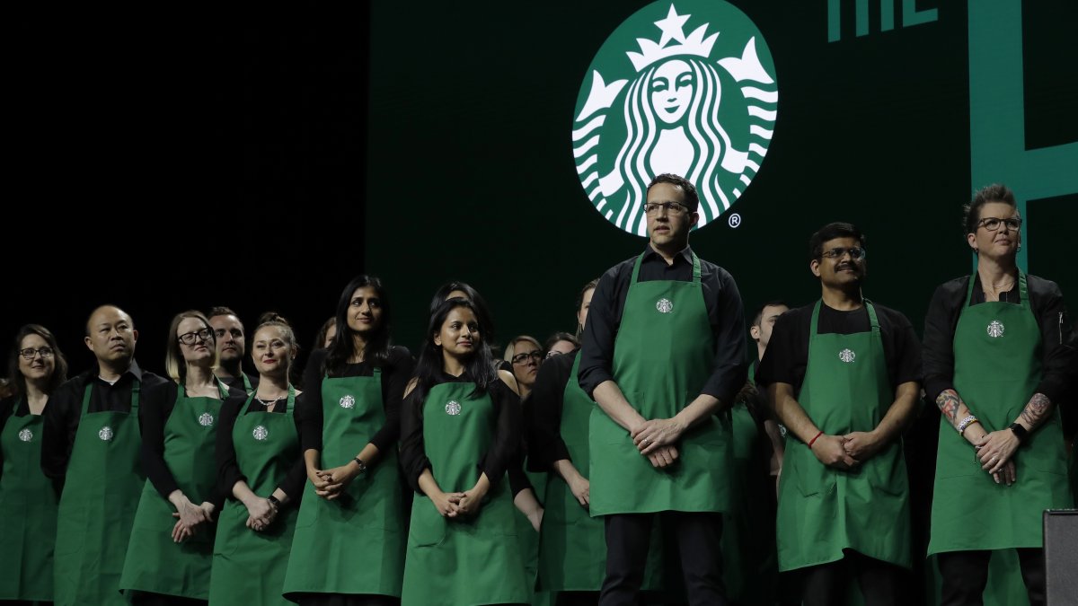Starbucks baristas stand on stage during an annual shareholders meeting in Seattle, U.S., March 20, 2019. (AP Photo)