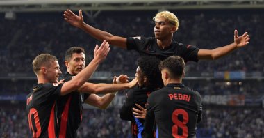 Barcelona&#039;s Lamine Yamal (C) celebrates scoring his team&#039;s first goal during the La Liga match against Espanyol at the RCDE Stadium, Barcelona, Spain, May 15, 2025. (AFP Photo)