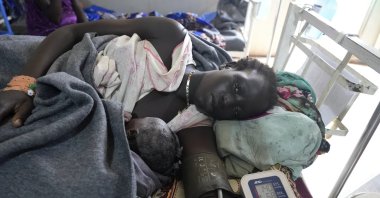 A woman lies with her newborn in the maternal ward of the Doctors Without Borders-run hospital, Bentiu, South Sudan, June 24, 2024. (AP Photo)