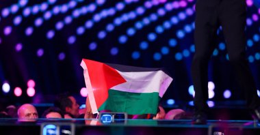 A member of the audience holds a Palestinian flag during the first semifinal of the 2025 Eurovision Song Contest, Basel, Switzerland, May 13, 2025. (Reuters Photo)