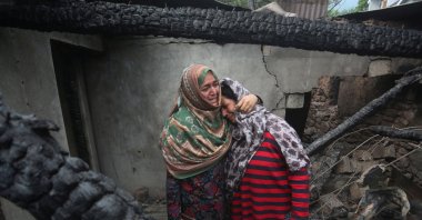 Kashmiri women grieve inside their house damaged after cross-border shelling from Pakistan, at Salamabad village, Uri, Kashmir, May 8, 2025. (EPA Photo)