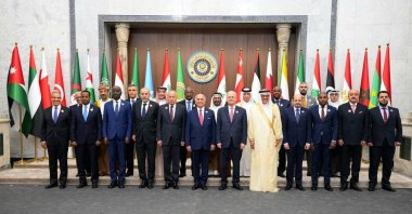 A handout picture released by the media office of Iraq's prime minister on May 15, 2025 shows Iraqi Foreign Minister Fuad Hussein (C) posing for a group picture in Baghdad with counterparts from the Arab League member states during their meeting to prepare Iraq's upcoming Arab summit, scheduled for this weekend. (Handout via AFP)