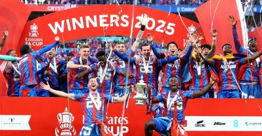 Crystal Palace&#039;s Joel Ward and Marc Guehi with the trophy as they celebrate with teammates after winning the FA Cup, FA Cup at the Wembley Stadium, London, U.K., May 17, 2025. (Reuters Photo)