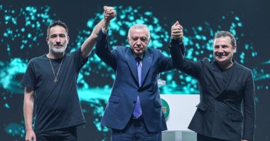 Rapper Sagopa Kajmer (L), President Recep Tayyip Erdoğan (C) and musician Ferhat Göçer greet people during a concert as part of “GENÇFEST: A Youth Festival,” Istanbul, Türkiye, May 18, 2025. (AA Photo)