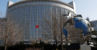A Chinese flag flutters near a globe installation outside the Chinese Foreign Ministry, Beijing, China, Feb. 24, 2022. (Reuters Photo)