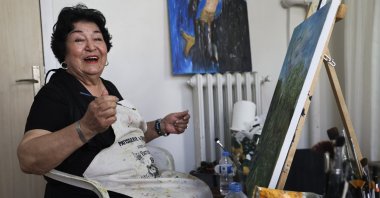 Filiz Gürel paints in her studio at the Etiler Nursing Home Elderly Care and Rehabilitation Center, Istanbul, Türkiye, April 22, 2025. (AA Photo)