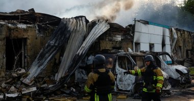 Firefighters work at the site of a Russian drone strike, outside of Kyiv, Ukraine, May 18, 2025. (Reuters Photo)