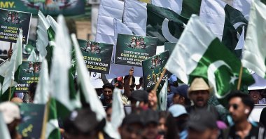 Pakistani university students hold placards and wave national flags during a rally to show solidarity with the Pakistani armed forces, in Karachi, Pakistan, May 15, 2025. (EPA Photo)
