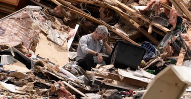 James Sexton is overcome by emotions while cleaning up the debris of his house in the community of Sunshine Hills outside of London, Kentucky, U.S., May 18, 2025. (AFP Photo)