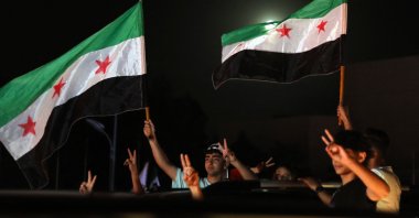 People celebrate in the Omeyyad square after U.S. President Donald Trump&#039;s decision to lift Syria sanctions, Damascus, Syria, May 13, 2025. (AFP Photo)