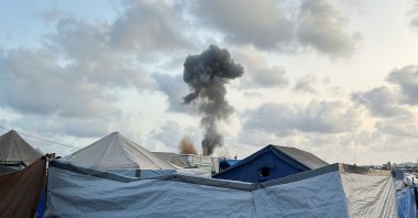 Smoke rises following Israeli strikes, as seen from a tent camp sheltering displaced Palestinians, Khan Younis, southern Gaza Strip, Palestine, May 19, 2025. (Reuters Photo)
