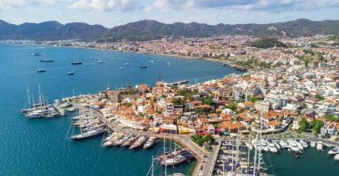An aerial view of Marmaris with its beautiful coastline and bustling marina, a vibrant port city on the Turkish Riviera, Türkiye. (Shutterstock Photo)