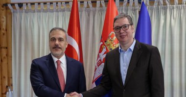 Foreign Minister Hakan Fidan shakes hands with Serbian President Aleksandar Vucic in Belgrade, May 19, 2025. (AA Photo)
