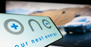 Smartphone with the logo of the American company Our Next Energy (ONE) on screen in front of a business website, Stuttgart, Germany, March 17, 2023. (Shutterstock Photo)