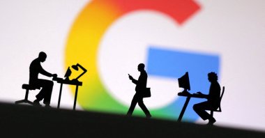 Miniature figures of people are seen in front of the new Google logo in this illustration taken May 13, 2025. (Reuters Photo)
