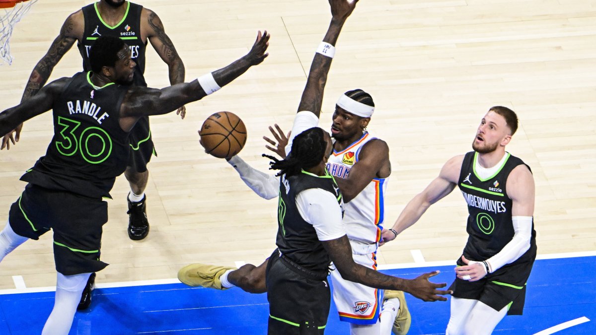 Oklahoma City Thunder guard Shai Gilgeous-Alexander (2nd R), shoots against Minnesota Timberwolves forward Julius Randle (L) and Minnesota Timberwolves center Naz Reid (C), during the second half of the Western Conference finals playoff game 1 at Paycom Center, Oklahoma City, U.S., May 20, 2025. (EPA Photo)