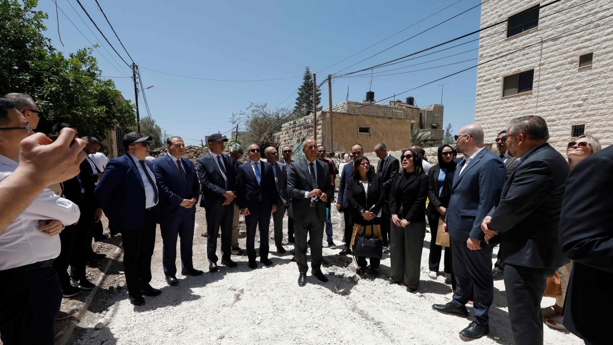 Members of a diplomatic delegation from the European Union gather near the eastern entrance of Jenin camp during a visit to the city of Jenin, May 21, 2025. (AFP Photo)