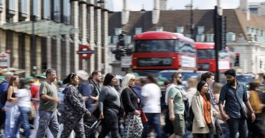 People cross a street in Westminster, London, U.K., 12 May 2025. (EPA Photo)