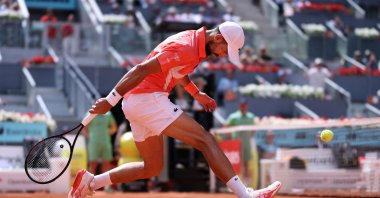 Serbia&#039;s Novak Djokovic returns the ball to Italy&#039;s Matteo Arnaldi during their 2025 ATP Tour Madrid Open tennis tournament second-round singles match at the Caja Magica, Madrid, Spain, April 26, 2025. (AFP Photo)