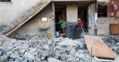 Palestinian boys look on at the site of an Israeli strike on a house, in Jabalia, northern Gaza Strip, Palestine, May 21, 2025. (Reuters Photo)