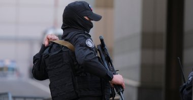 A Russian law enforcement officer secures the area near the accident scene following a reported Ukrainian drone shot down in Moscow, Russia, Aug.18, 2023. (Reuters File Photo)