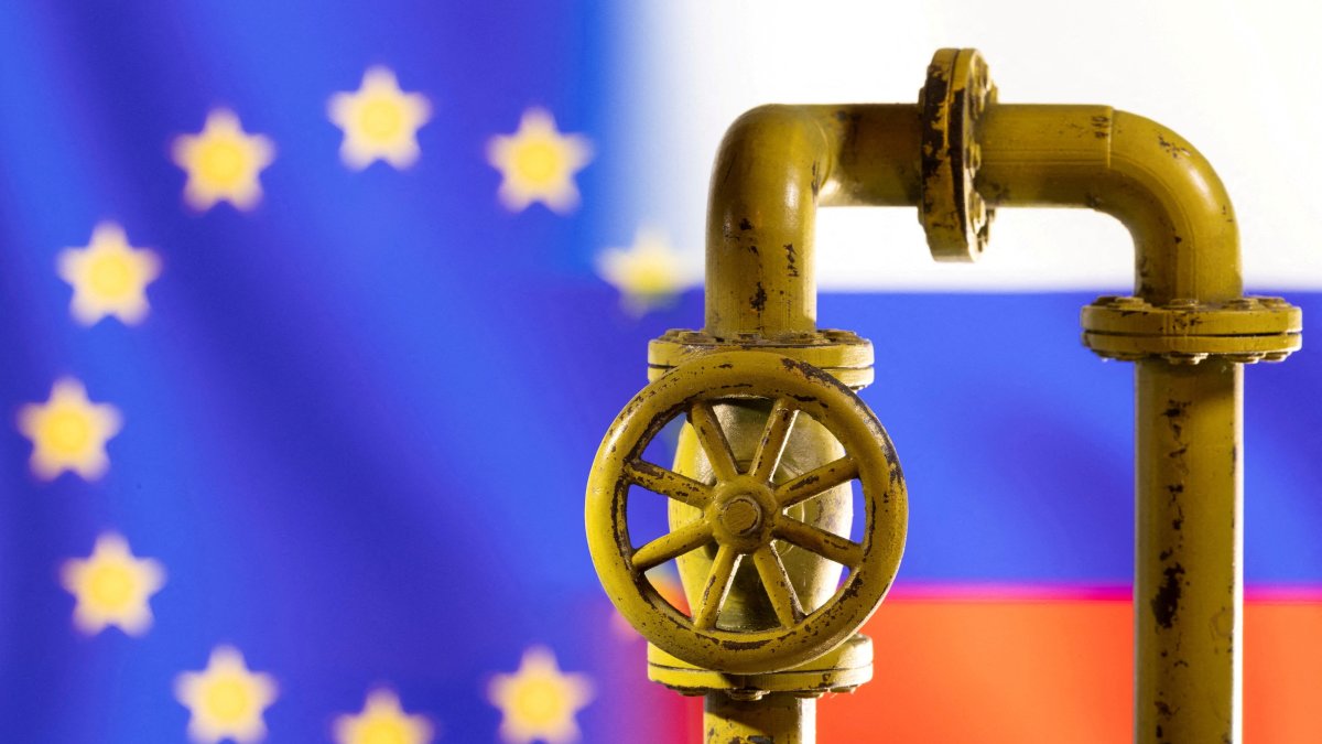 A model of the natural gas pipeline is seen in front of the EU and Russia flags in this illustration taken on March 8, 2022. (Reuters Photo)
