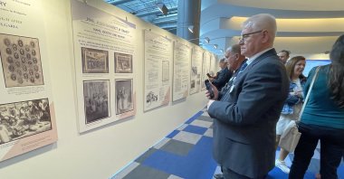 Visitors explore the "Name, Identity and Memory: The 40th Anniversary of the Final Phase of Forced Name Changes of Muslim-Turkish Names in Bulgaria" exhibition, Brussels, Belgium, May 21, 2025. (AA Photo)