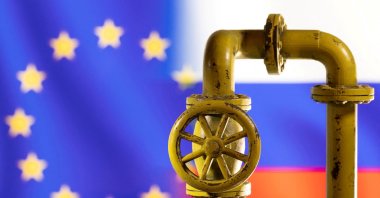 A model of the natural gas pipeline is seen in front of the EU and Russia flags in this illustration taken on March 8, 2022. (Reuters Photo)