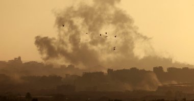 A picture taken from a position on the Israeli side of the border with the Gaza Strip shows smoke billowing following Israeli bombardment in the besieged Palestinian territory, May 21, 2025. (AFP Photo)