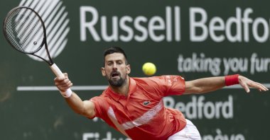 Serbia&#039;s Novak Djokovic returns a ball to Hungary&#039;s Marton Fucsovics during the round of 16 match at the ATP 250 Geneva Open Tennis Tournament, Geneva, Switzerland, May 21, 2025 (AP Photo)