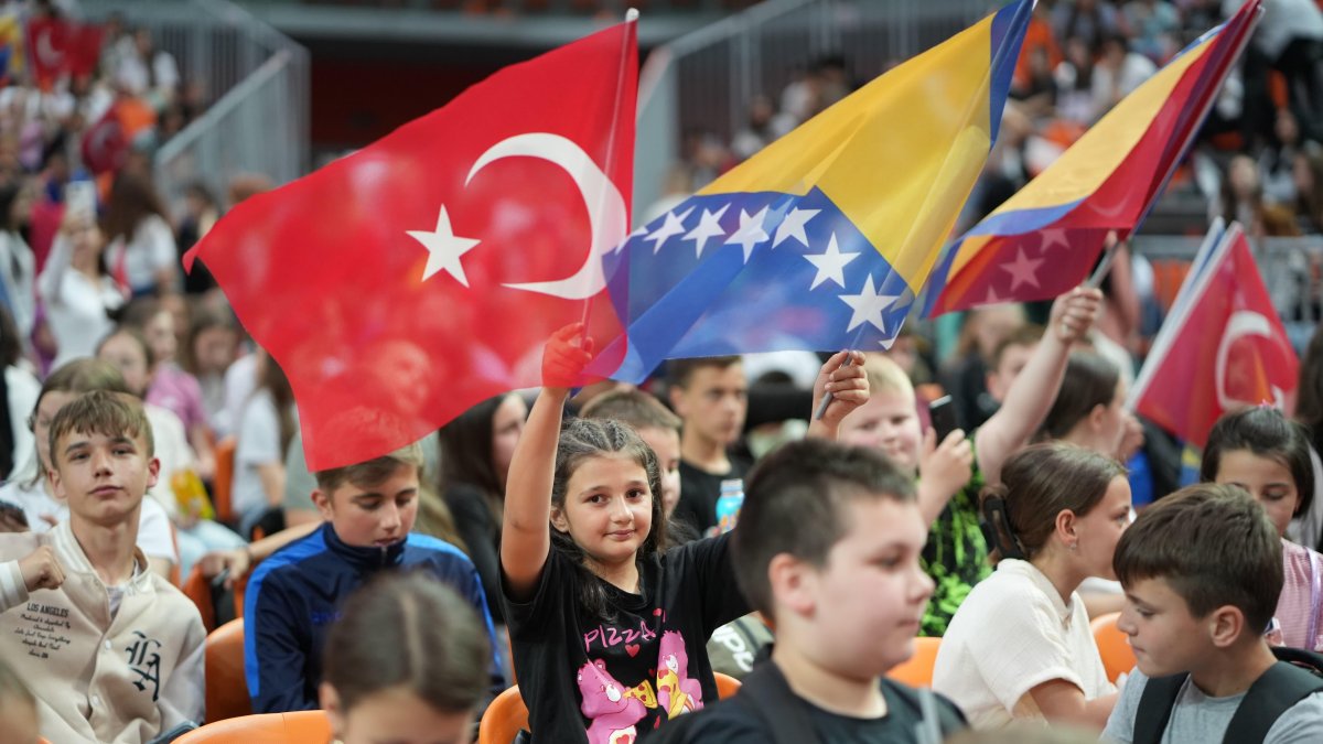 A child holds the flags of Türkiye and Bosnia-Herzegovina during the “My Choice is Turkish” Children’s Festival, Zenica, Bosnia-Herzegovina, May 22, 2025. (AA Photo)