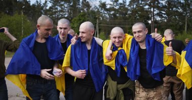 Ukrainian POWs pose for photographs after their exchange, in this handout photograph taken and released by the Ukrainian Presidential press-service, May 23, 2025. (AFP Photo)