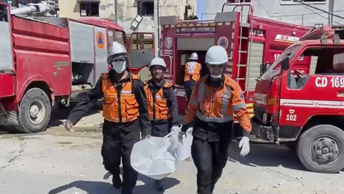 In this frame grab from a video released by Gaza Civil Defense, workers collect human remains after an Israeli strike on a home in Khan Younis killed nine of a doctor&#039;s ten children while she was at work, according to Ahmad al-Farra, head of the pediatric department at Nasser Hospital, Khan Younis, Gaza Strip, May 24, 2025. (AP Photo)