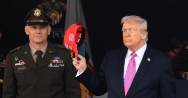 US President Donald Trump removes his hat as he departs after delivering the commencement address at the 2025 U.S. Military Academy Graduation Ceremony at West Point, New York, U.S., May 24, 2025. (AFP Photo)