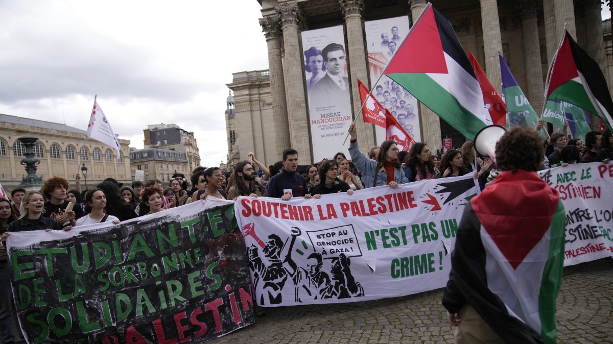 Students wave Palestinian flags and chant pro-Gaza slogans during a demonstration at the Pantheon monument, Paris, France, May 3, 2024. (AP Photo)