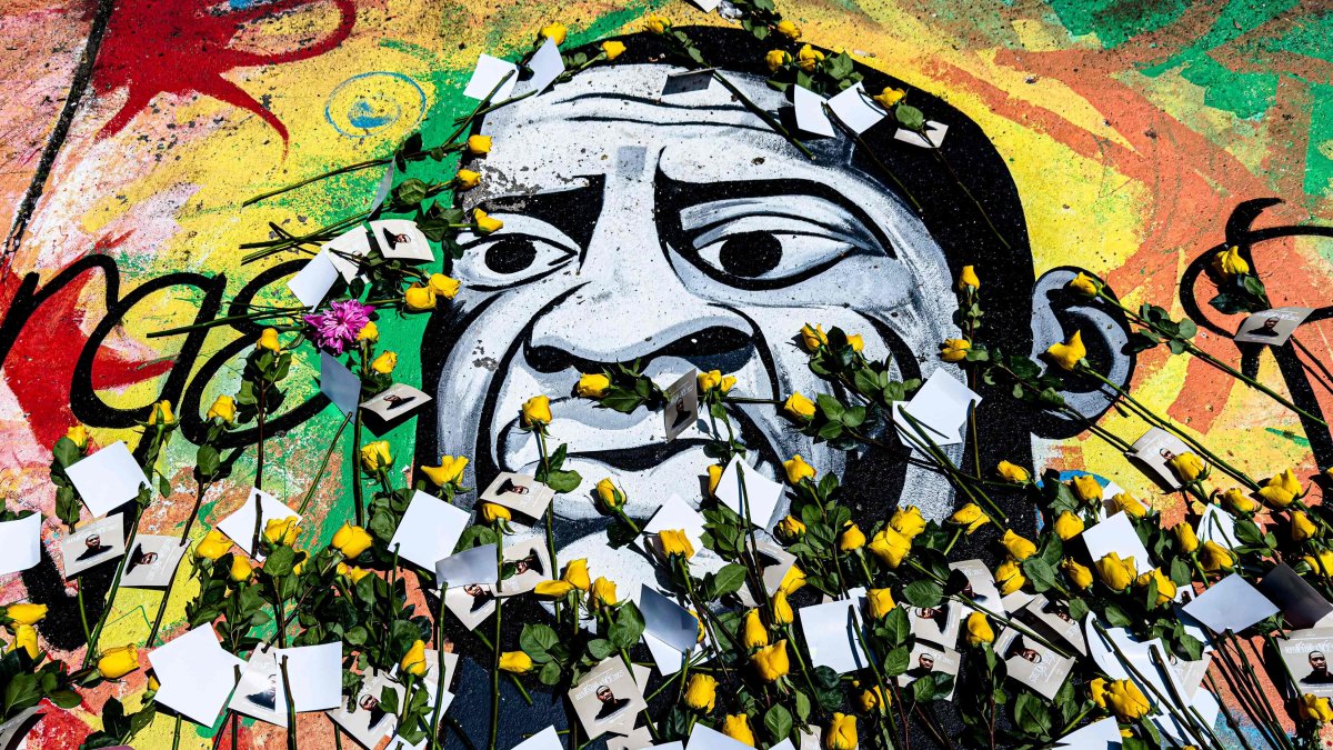 A mural of George Floyd is adorned with yellow roses and paper notes at George Floyd Square, in Minneapolis, Minnesota, U.S., May 23, 2025. (AFP Photo)