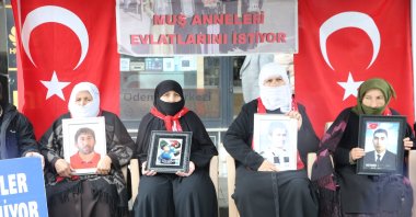 Families, holding photographs of their children abducted by the PKK, gather outside the local office of the Peoples&#039; Equality and Democracy Party (DEM Party), as the PKK disbands and ends a 40-year Türkiye insurgency, Muş, Türkiye, May 14, 2025. (AA Photo)