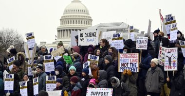 Medical researchers from universities and the National Institutes of Health rally near the Health and Human Services headquarters against federal cuts, Washington, D.C., U.S., Feb. 19, 2025. (AP Photo)
