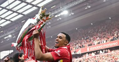 Liverpool&#039;s Trent Alexander-Arnold celebrates with the Premier League trophy at the end of the English Premier League football match between Liverpool and Crystal Palace at Anfield, Liverpool, U.K., May 25, 2025. (AFP Photo)