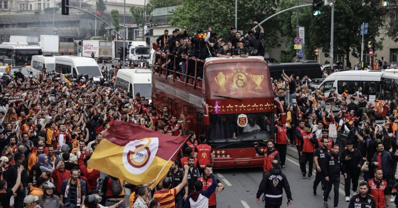 Players of Galatasaray celebrate on the bus with the supporters during the ceremony for the victory of the Turkish Süper Lig 2024-2025 season, Istanbul, Türkiye, May 25, 2025. (EPA Photo)