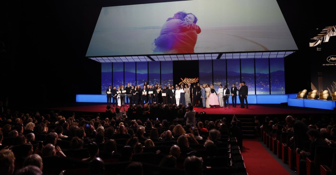 Iranian director Jafar Panahi (C) celebrates with other awardees and jury members on stage after winning the Palme d&#039;Or during the 78th annual Cannes Film Festival, Cannes, France, May 24,  2025. (EPA Photo)