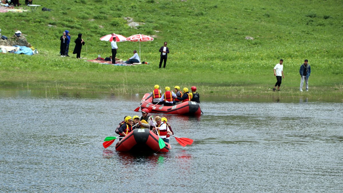Boats glide across a mountain lake during festival celebrations on Mencel Plateau, Hakkari, Türkiye, May 26, 2025. (DHA Photo)