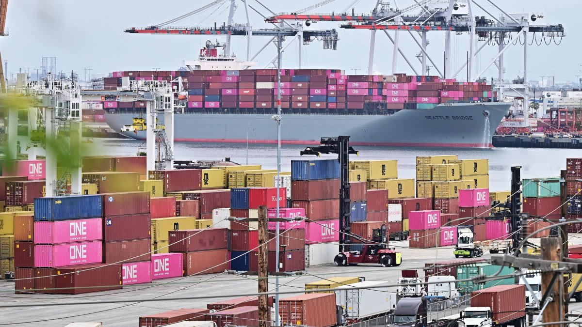 The Seattle Bridge container ship, sailing under the flag of Panama, is seen in the background of stacked containers in the Port of Los Angeles, California, U.S., May 6, 2025. (AFP Photo)