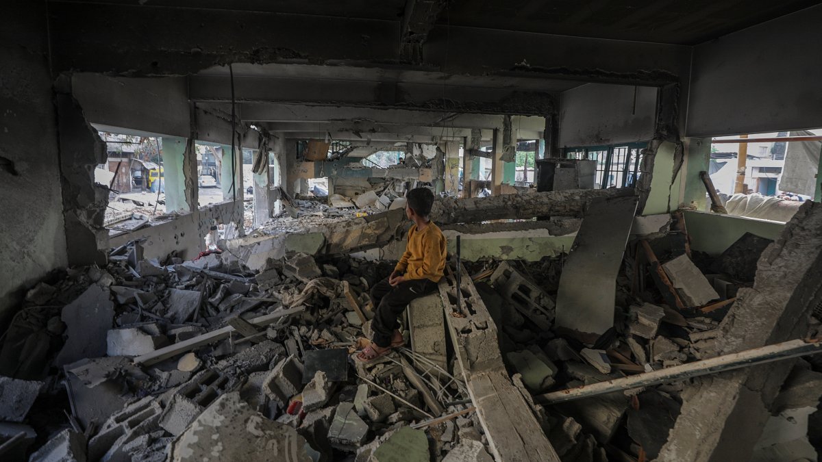 An internally displaced Palestinian boy sits at the destroyed building of Al Jerjawi school following an Israeli airstrike in Al Daraj neighborhood in Gaza City, May 26, 2025. (EPA Photo)
