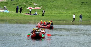 Boats glide across a mountain lake during festival celebrations on Mencel Plateau, Hakkari, Türkiye, May 26, 2025. (DHA Photo)