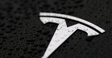 The logo of Tesla is seen on a Tesla car in Brussels, Belgium, April 24, 2025. (Reuters Photo)