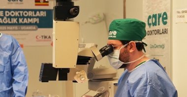 A Turkish doctor performs surgery during a health camp organized by the Turkish Cooperation and Coordination Agency (TIKA), Yumbe region, Uganda, May 26, 2025. (IHA Photo)