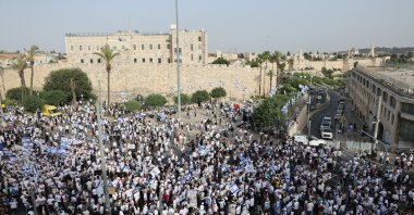 Israeli youths dancing with flags to celebrate the occupation of East Jerusalem, near the Old City of Jerusalem, May 26, 2025. (EPA Photo)