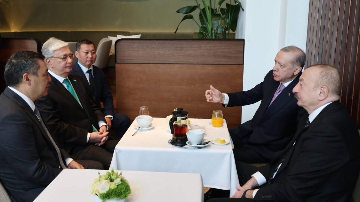 President Recep Tayyip Erdoğan gestures as he meets with Kazakh President Kassym-Jomart Tokayev (2-L) and Azerbaijani President Ilham Aliyev (R) during the informal summit of the Organization of Turkic States (OTS), Budapest, Hungary, May 21, 2025. (AA Photo)
